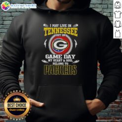 Green Bay Packers hoodie with 'I may live in Tennessee, but my heart belongs to the Packers' slogan on display.
