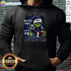 Alt Text: Awesome Grinch Santa Hat hoodie for Seattle Seahawks fans - NFL Christmas gear, 'They Hate Us Because They Ain't Us'