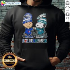 Alt Text: Cute Charlie Brown fist bump with Snoopy in Philadelphia skyline hoodie featuring 76ers and Eagles logos.
