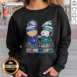 Adorable Charlie Brown fist bump with Snoopy on a Philadelphia skyline sweatshirt for 76ers and Eagles fans.