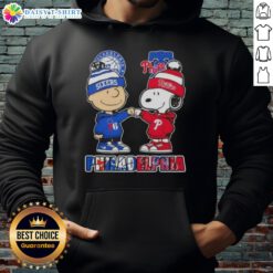 Cute Charlie Brown fist bump with Snoopy on a Philadelphia sports hoodie for 76ers and Phillies fans.