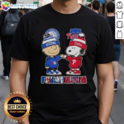 Alt Text: Cute Charlie Brown and Snoopy fist bump on Philadelphia sports T-shirt featuring 76ers and Phillies logos.