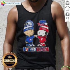 Cute Charlie Brown fist bump with Snoopy on a Philadelphia City Sports 76ers X Phillies tank top design.