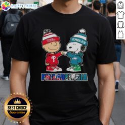 Alt Text: Cute Charlie Brown and Snoopy fist bump on a Philadelphia City Sports t-shirt featuring Phillies and Eagles design.