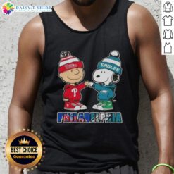 Cute Charlie Brown fist bumping Snoopy in Philadelphia sports tank top, showcasing Phillies and Eagles team spirit.