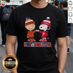 Cute Charlie Brown fist bumping Snoopy on Philadelphia sports T-shirt featuring Phillies and Flyers team logos.