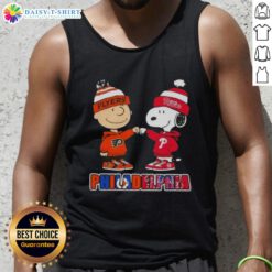 Alt Text: Cute Charlie Brown fist bump with Snoopy in Phillies and Flyers tank top, perfect for Philadelphia sports fans.