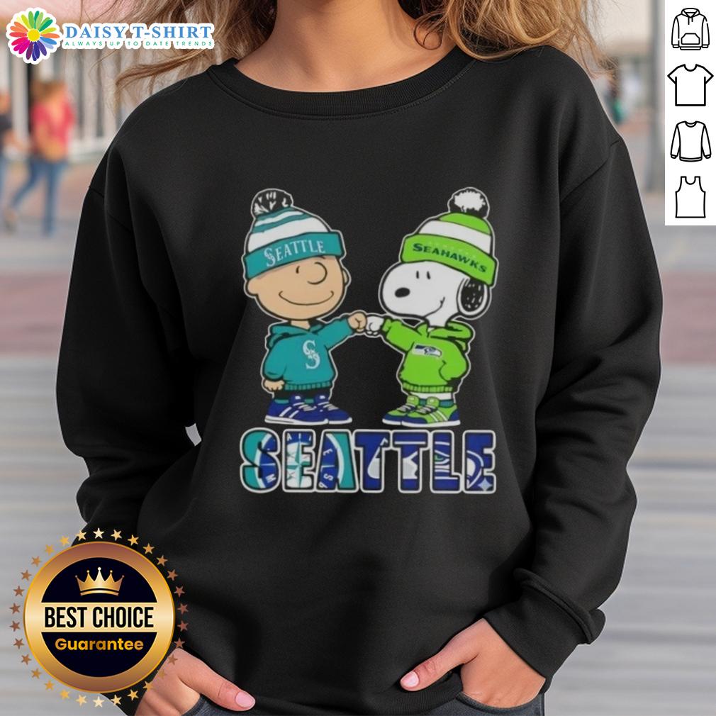 Cute Charlie Brown and Snoopy fist bump in Seattle sports sweatshirt featuring Mariners and Seahawks logos.
