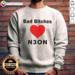 Women wearing a 'Good Bad Bitches Love Neon' sweatshirt in vibrant neon colors, showcasing trendy streetwear fashion.