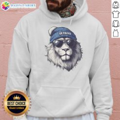 Alt Text: Detroit Lions mascot wearing a beanie and sunglasses, sporting a hoodie, showcasing team spirit and style.