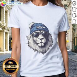 Detroit Lions mascot wearing a beanie and sunglasses on a ladies' tee, showcasing team spirit and style.
