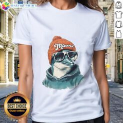 Miami Dolphins mascot in a beanie and sunglasses on a ladies tee, showcasing team spirit and style.