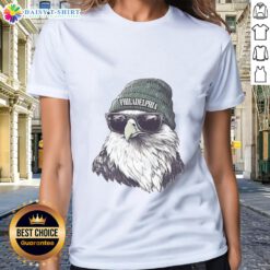Alt Text: Philadelphia Eagles mascot in a beanie and sunglasses, showcasing team spirit on a ladies tee.