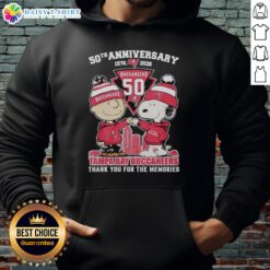 Alt Text: Stylish Tampa Bay Buccaneers hoodie featuring Snoopy and Charlie Brown for the 50th Anniversary, 1976-2026.