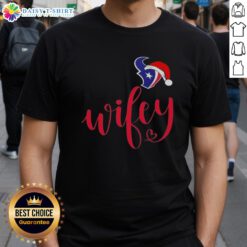 Alt Text: Good Wifey Houston Texans Santa Hat Merry Christmas T-Shirt featuring festive design for holiday football fans.