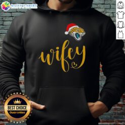 Good Wifey Jacksonville Jaguars Santa Hat Merry Christmas Hoodie worn by a fan, showcasing team spirit and holiday cheer.
