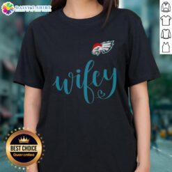 Good Wifey Philadelphia Eagles Santa Hat Merry Christmas Ladies Tee in festive green with holiday graphics.