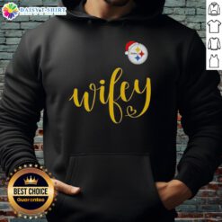 Woman wearing a Pittsburgh Steelers Santa hat and Merry Christmas hoodie, celebrating the holidays in style.