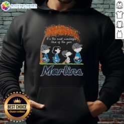 Cozy hoodie featuring Miami Marlins and Peanuts Snoopy for autumn, perfect for celebrating the most wonderful time of the year.