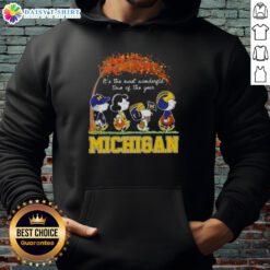 Happy Michigan Wolverines X Peanuts Snoopy hoodie featuring autumn themes, perfect for celebrating the season.