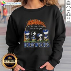 Cozy sweatshirt featuring Milwaukee Brewers, Snoopy, and friends celebrating autumn in a festive design.