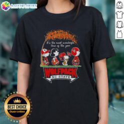 Happy NC State Wolfpack tee featuring Peanuts Snoopy and friends, perfect for autumn celebrations and holiday cheer.
