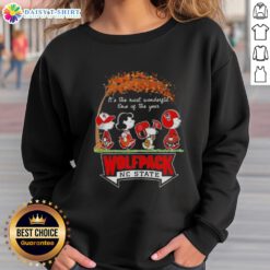 Happy NC State Wolfpack sweatshirt featuring Snoopy and friends, perfect for autumn and celebrating the most wonderful time of the year.