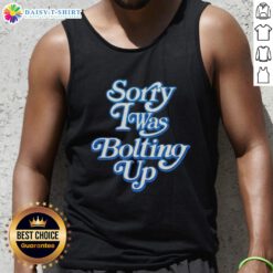 Happy woman wearing a 'Sorry I Was Bolting Up' tank top, smiling outdoors in a vibrant, sunny setting.