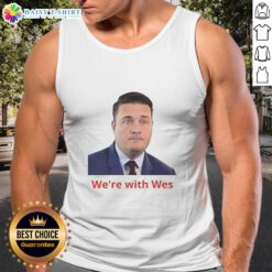 Happy Wes wearing a stylish 'We're With Wes' tank top, showcasing a fun and vibrant street style.