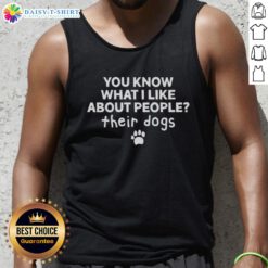 Alt Text: Happy woman wearing 'You Know What I Like About People? Their Dogs' tank top, enjoying time outdoors with a dog.