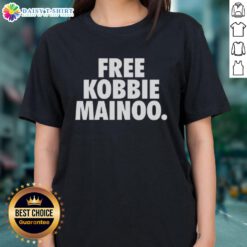 Alt Text: Nice Free Kobbie Mainoo Manchester United FC Ladies Tee showcasing team colors and logo on a stylish design.