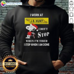 Snoopy Christmas hoodie featuring 'I work at J.B. Hunt, I don't stop when I'm tired, I stop when I'm done' slogan.