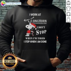Alt Text: Snoopy Christmas hoodie with 'I work at Longhorn Steakhouse, I don't stop when I'm tired, I stop when I'm done' design.