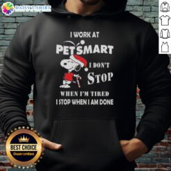 Cozy Snoopy Christmas hoodie saying 'I work at PetSmart, I don't stop when I'm tired, I stop when I'm done.'