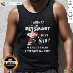 Christmas tank top featuring Snoopy with the phrase 'I work at PetSmart, I dont stop when Im tired, I stop when Im done.'