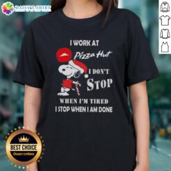 Christmas ladies tee featuring Snoopy with 'I work at Pizza Hut' and motivational quote about hard work.