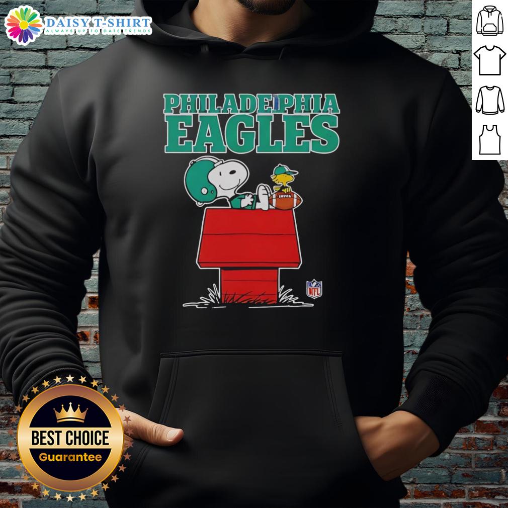 Official Philadelphia Eagles Snoopy hoodie in Peanuts style, featuring Snoopy relaxing with a football.