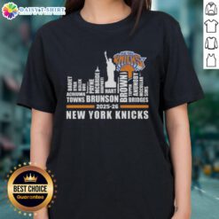 Top 2025-26 New York Knicks Basketball Ladies Tee featuring city skyline design and team names for fans.
