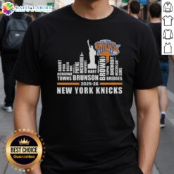 Alt Text: Top 2025-26 New York Knicks Basketball T-Shirt featuring city skyline design and player names, perfect for fans.