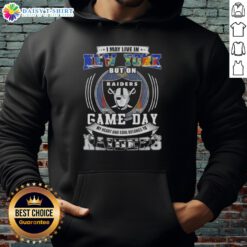 Alt Text: Fan wearing Las Vegas Raiders football hoodie, showcasing pride on game day despite living in New York.