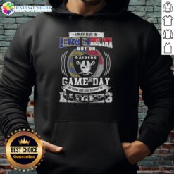 North Carolina fan wearing a Las Vegas Raiders hoodie, showcasing team spirit on game day.