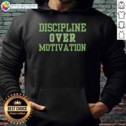 Person wearing a 'Good Discipline Over Motivation' hoodie during a gym workout, showcasing consistency and dedication.