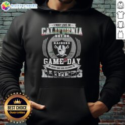 Person wearing a Las Vegas Raiders football hoodie, showcasing team spirit in California on game day.