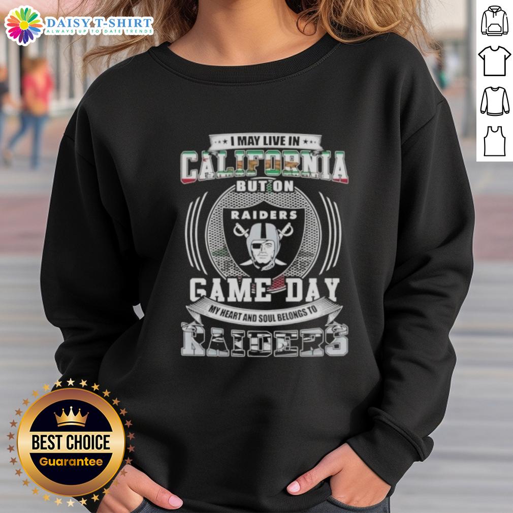 Alt Text: Fan wearing 'Good I May Live In California But My Heart Belongs To Las Vegas Raiders' sweatshirt on game day.