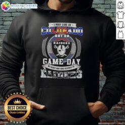 Person wearing a Las Vegas Raiders football hoodie, showcasing team pride despite living in Colorado on game day.
