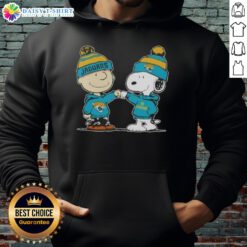 Good Peanuts Charlie Brown fist bump with Snoopy in Jacksonville Jaguars football hoodie, showcasing team spirit.