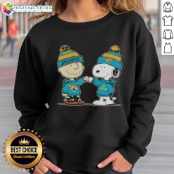 Charlie Brown and Snoopy fist bump in Good Peanuts sweatshirt celebrating Jacksonville Jaguars football spirit.