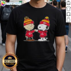 Good Peanuts Charlie Brown and Snoopy fist bump on Kansas City Chiefs football t-shirt design for fans.