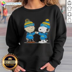 Alt Text: Charlie Brown and Snoopy fist bump in Los Angeles Chargers football sweatshirt, celebrating good vibes with peanuts.