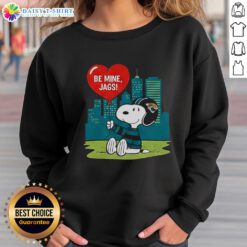 Happy Jacksonville Jaguars x Snoopy cartoon Valentine's sweatshirt for 2026, featuring fun graphics and team colors.